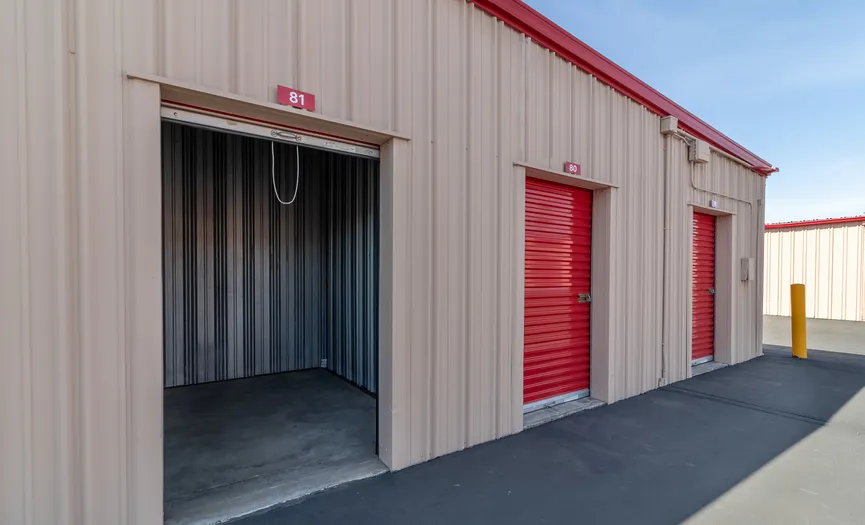 Outdoor ground floor storage units at a secure storage facility in Manteca near Highway 99