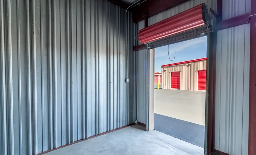 Inside view looking out from an outdoor storage unit at a secure storage facility in Manteca