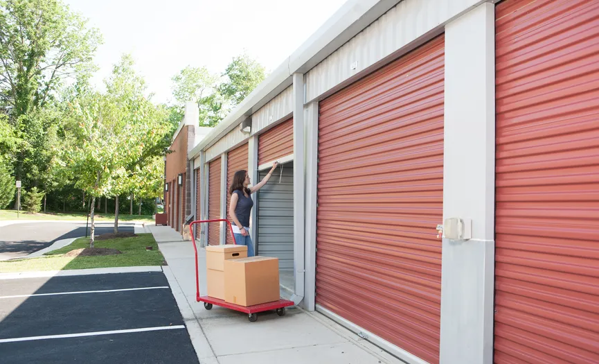 Customer moving items into a drive-up storage unit at Security Public Storage in Herndon