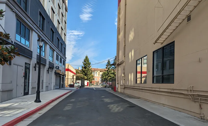 Side street entrance leading to the electronic gate and main office at Security Public Storage in Redwood City