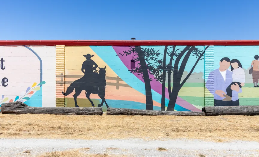 South wall mural with a rider on horseback, trees, and rural landscape near Security Public Storage at 271 Sun Way, Salinas CA