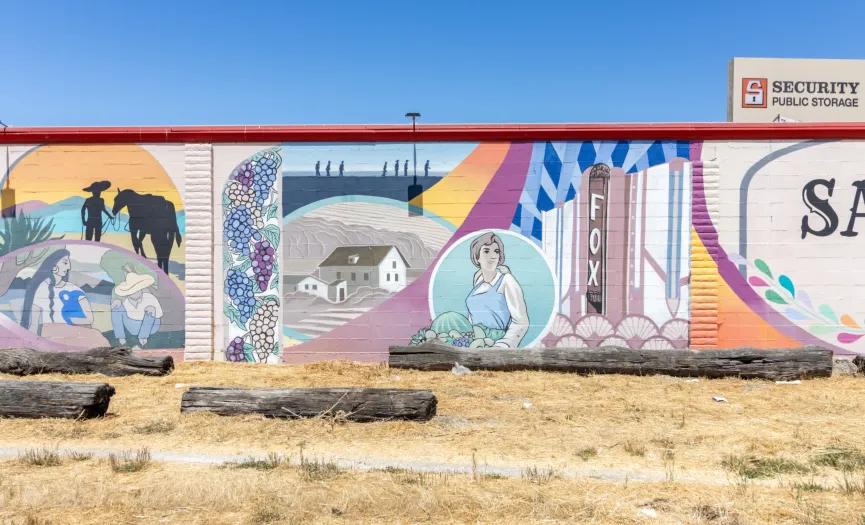 Mural depicting early Salinas settlers, rural homesteads, and the historic Fox Theater near Security Public Storage on Sun Way in Salinas, CA